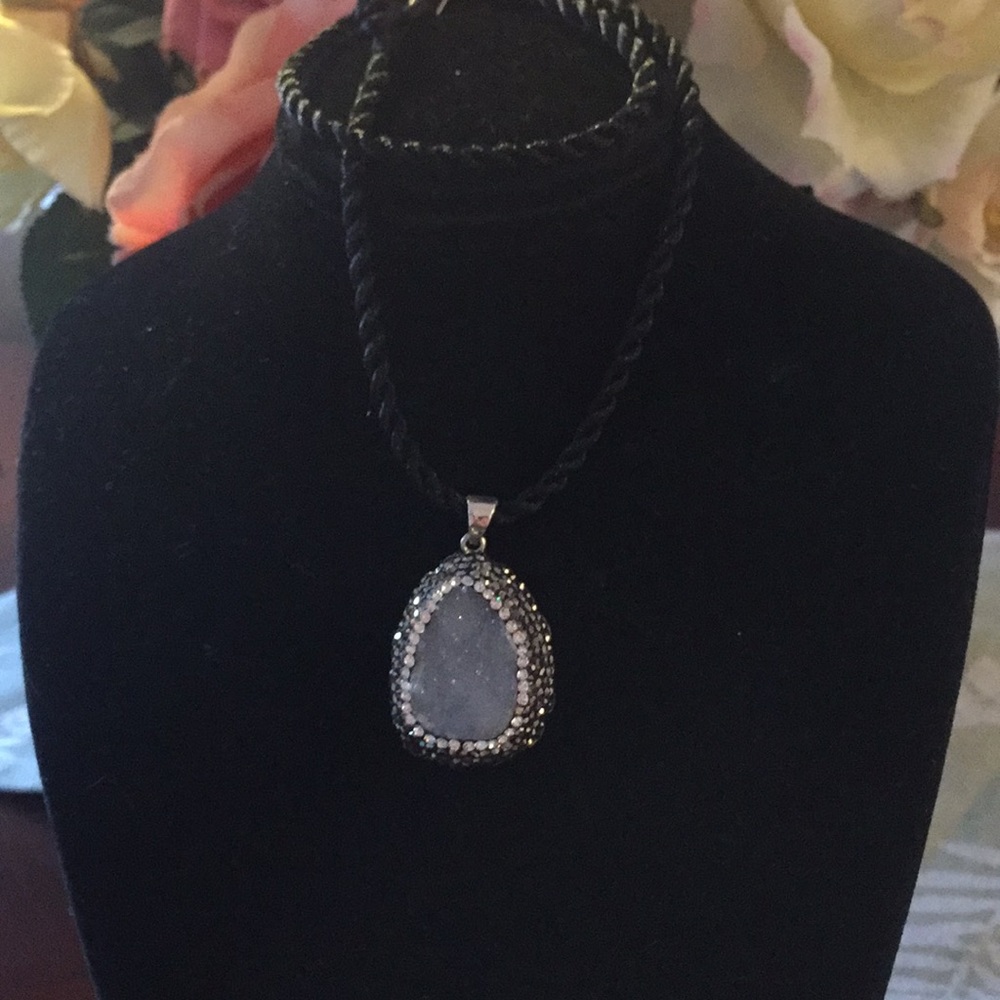 Druzy pend set in SS on a 16” black rope